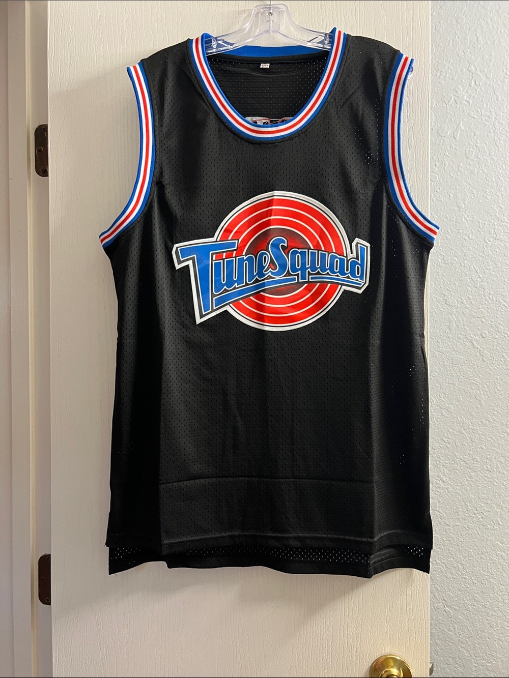Tune Squad Sleeveless Basketball Jersey in Black with Red & Blue Logo